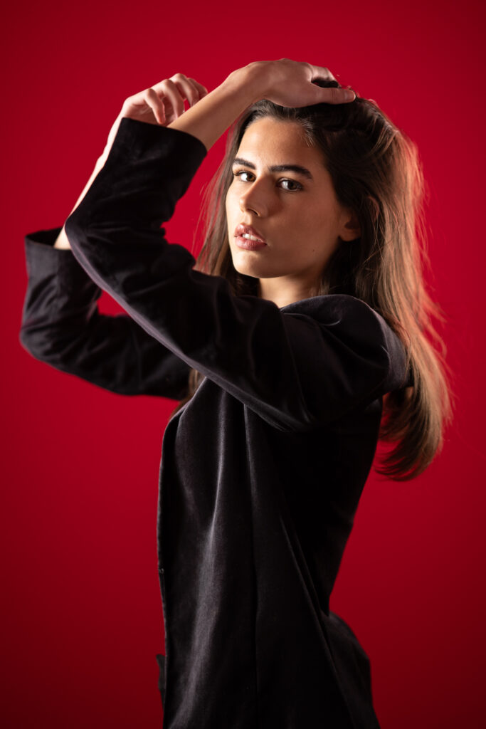 Trinity Hunt against a Scarlet Background